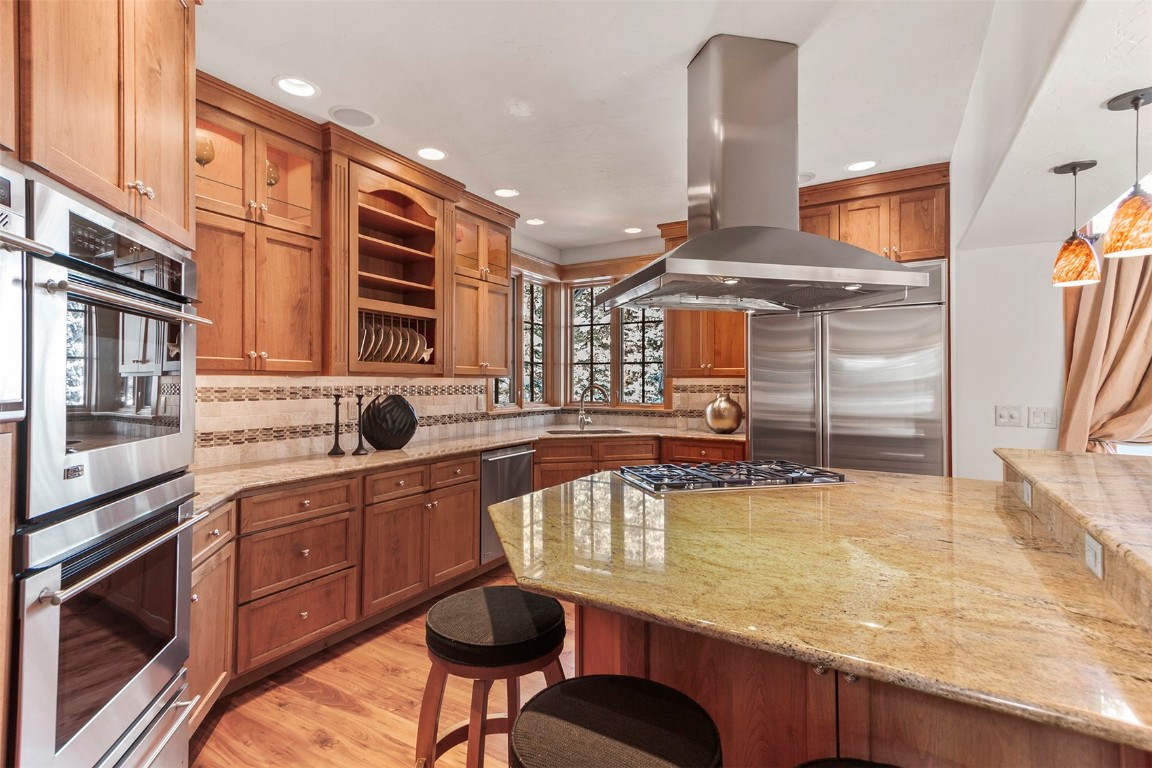780 Penstemon Road Keystone, CO 80435 - Photo 7 of 40 a kitchen with stainless steel appliances granite countertop a stove and a sink