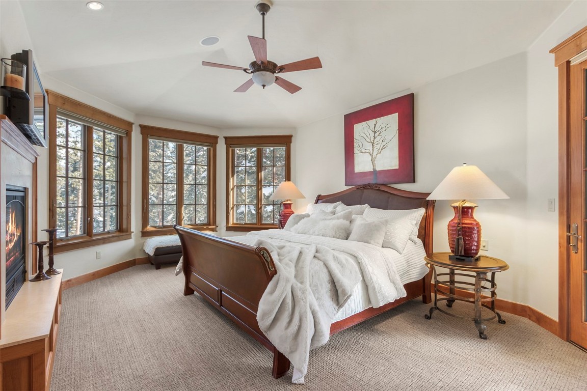 780 Penstemon Road Keystone, CO 80435 - Photo 8 of 40 a bed room with a bed and a chandelier