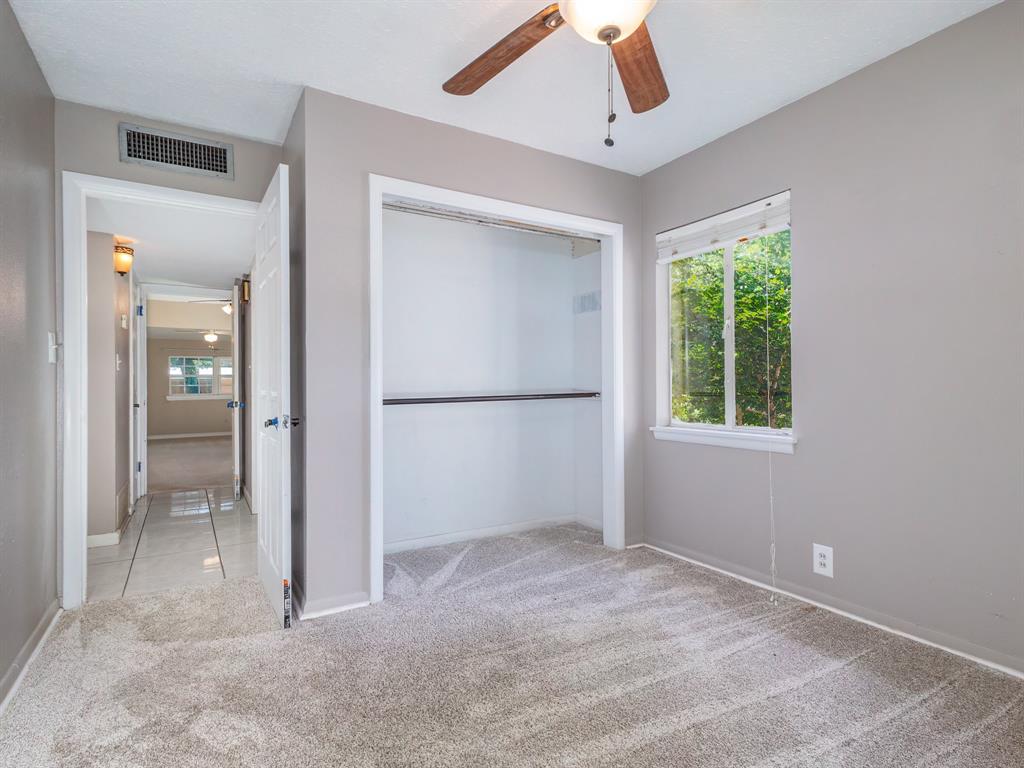 4002 Austin Avenue Brownwood, TX 76801 - Photo 21 of 34 an empty room with fan and windows