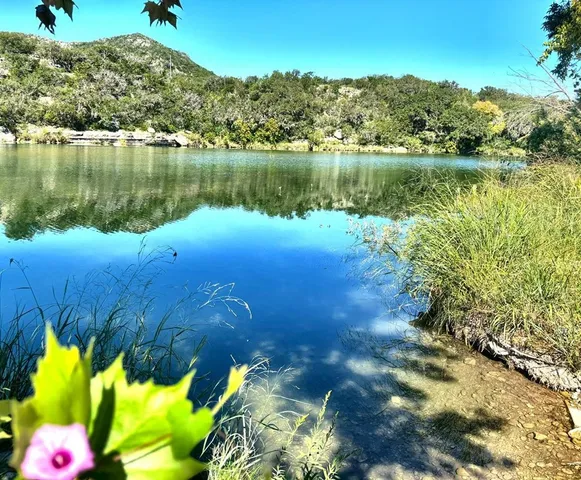 a view of a lake with a mountain in the background