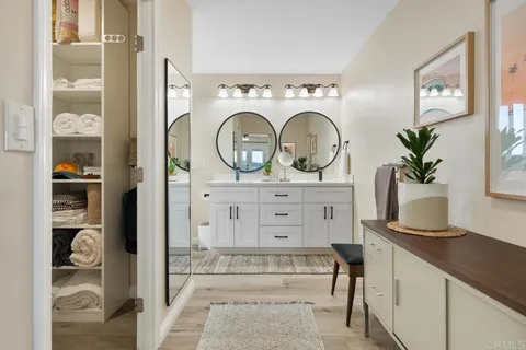 a view of hall way with furniture and window