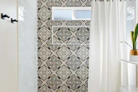 a workspace with wooden floor and a window