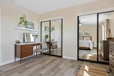 a view of balcony with couch and chairs