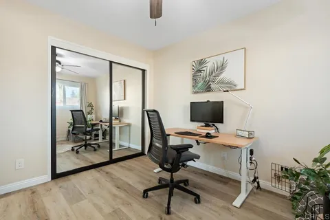 a view of a terrace with a bench and a grill