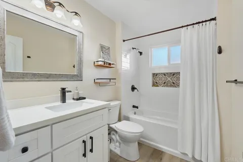 a view of a chairs and table in patio with a lake view