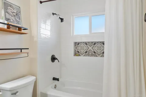 an outdoor space with furniture and umbrella