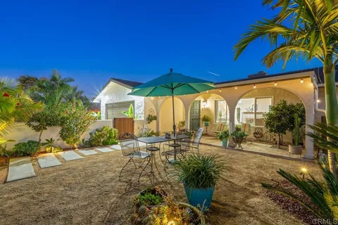a view of a house with backyard porch and patio