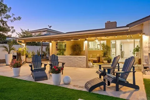 an aerial view of residential building and trees around