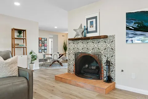a dining room with furniture and wooden floor
