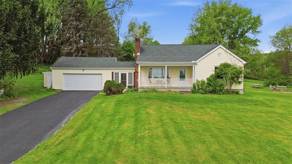 123 Wampum Road Wampum, PA 16157 - Photo 1 of 33 a front view of house with yard and green space
