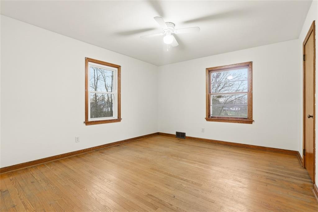 123 Wampum Road Wampum, PA 16157 - Photo 16 of 33 an empty room with windows and fan