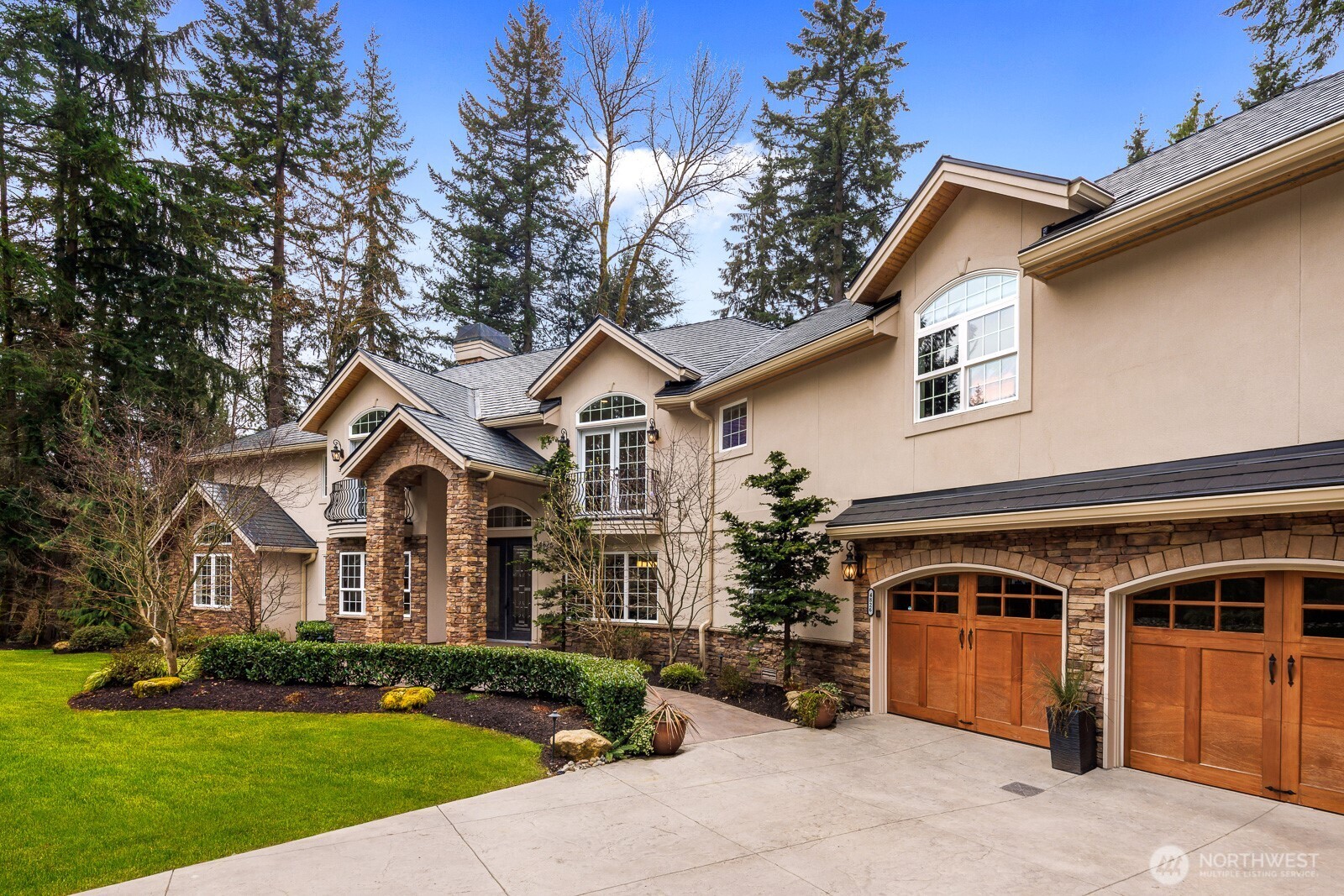 4826 196th Street Southeast Bothell, WA 98012 - Photo 2 of 40 a front view of a house with a yard and garage