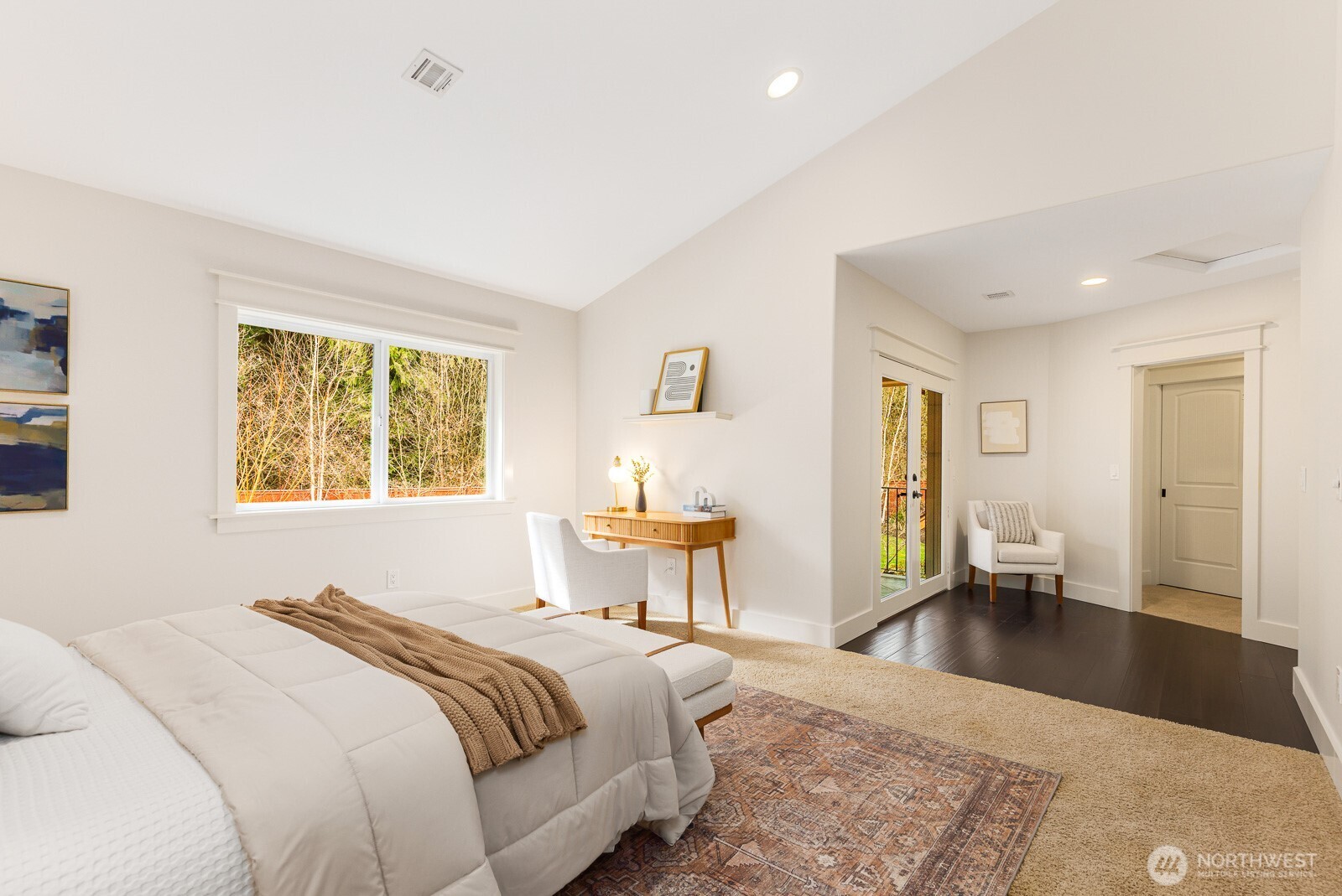 4826 196th Street Southeast Bothell, WA 98012 - Photo 27 of 40 a bedroom with a large bed and a couch