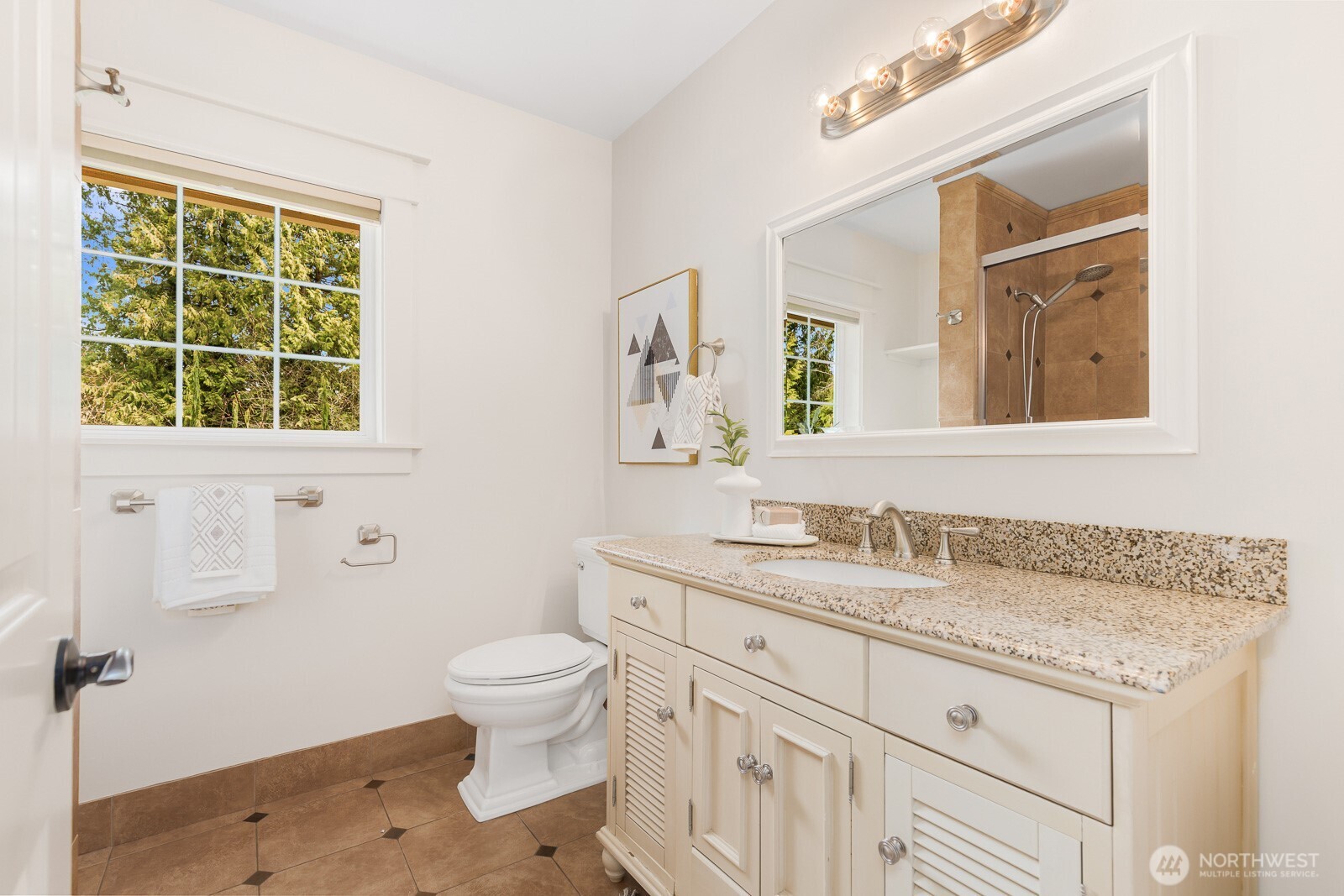 4826 196th Street Southeast Bothell, WA 98012 - Photo 28 of 40 a bathroom with a granite countertop sink toilet and a mirror
