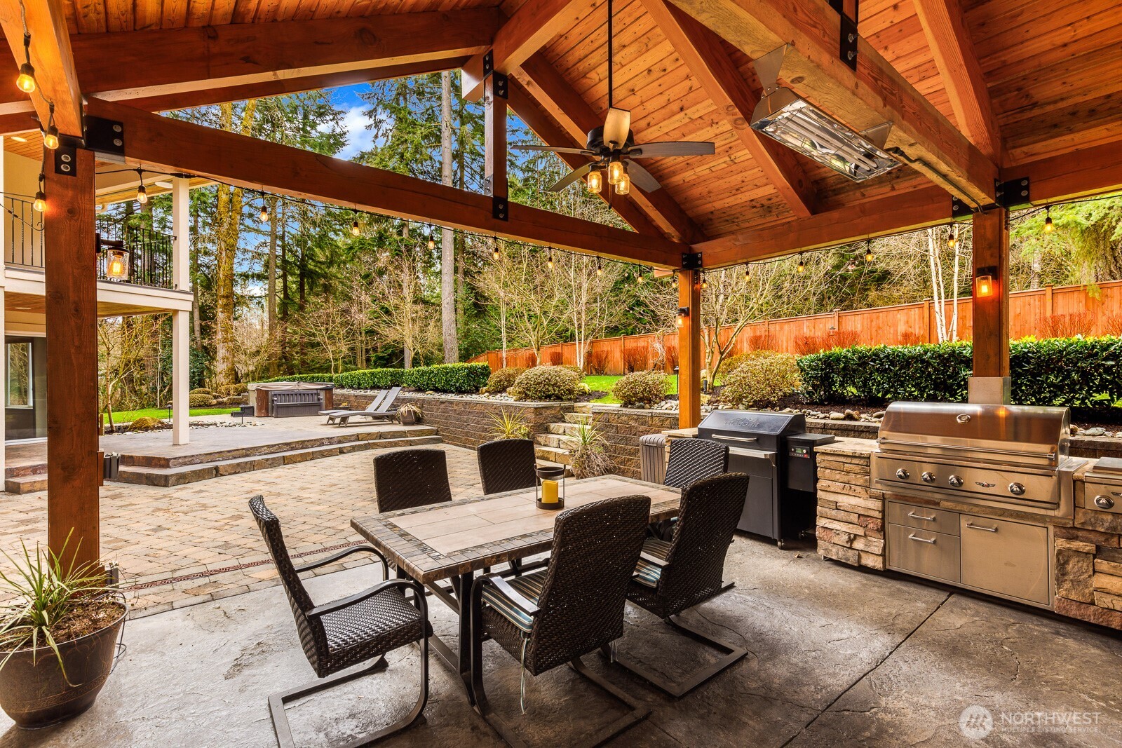4826 196th Street Southeast Bothell, WA 98012 - Photo 34 of 40 a view of a patio with dining table and chairs