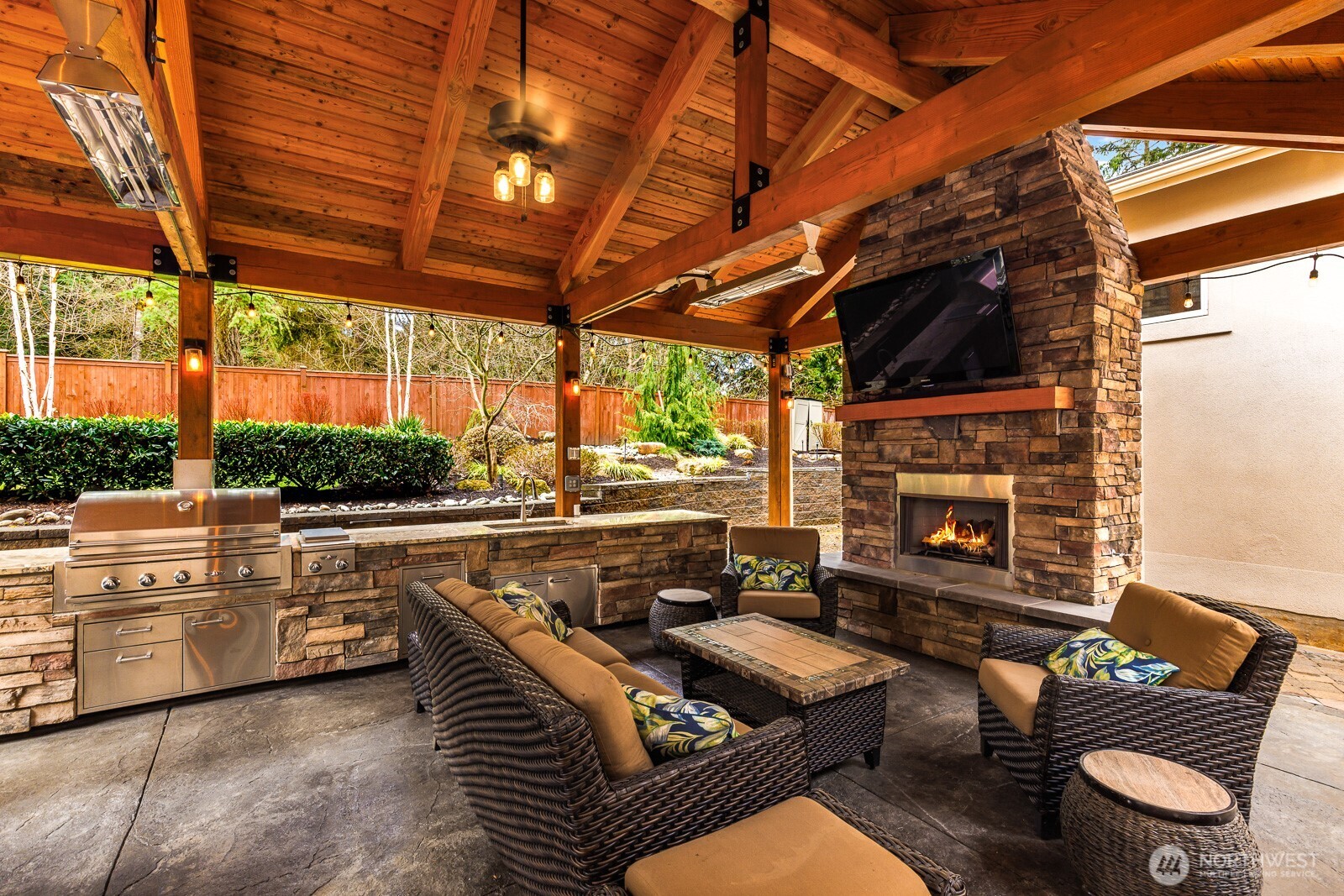 4826 196th Street Southeast Bothell, WA 98012 - Photo 35 of 40 a outdoor living space with patio furniture and a fireplace