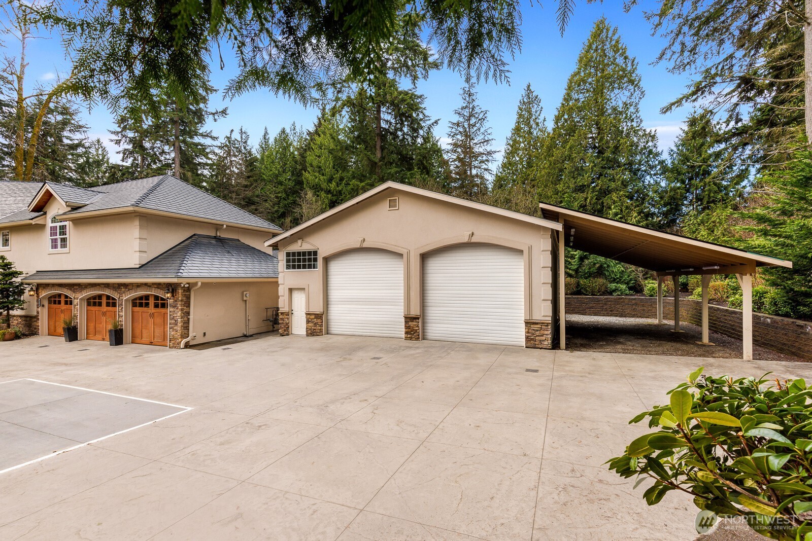 4826 196th Street Southeast Bothell, WA 98012 - Photo 36 of 40 a view of house with large trees and playing area
