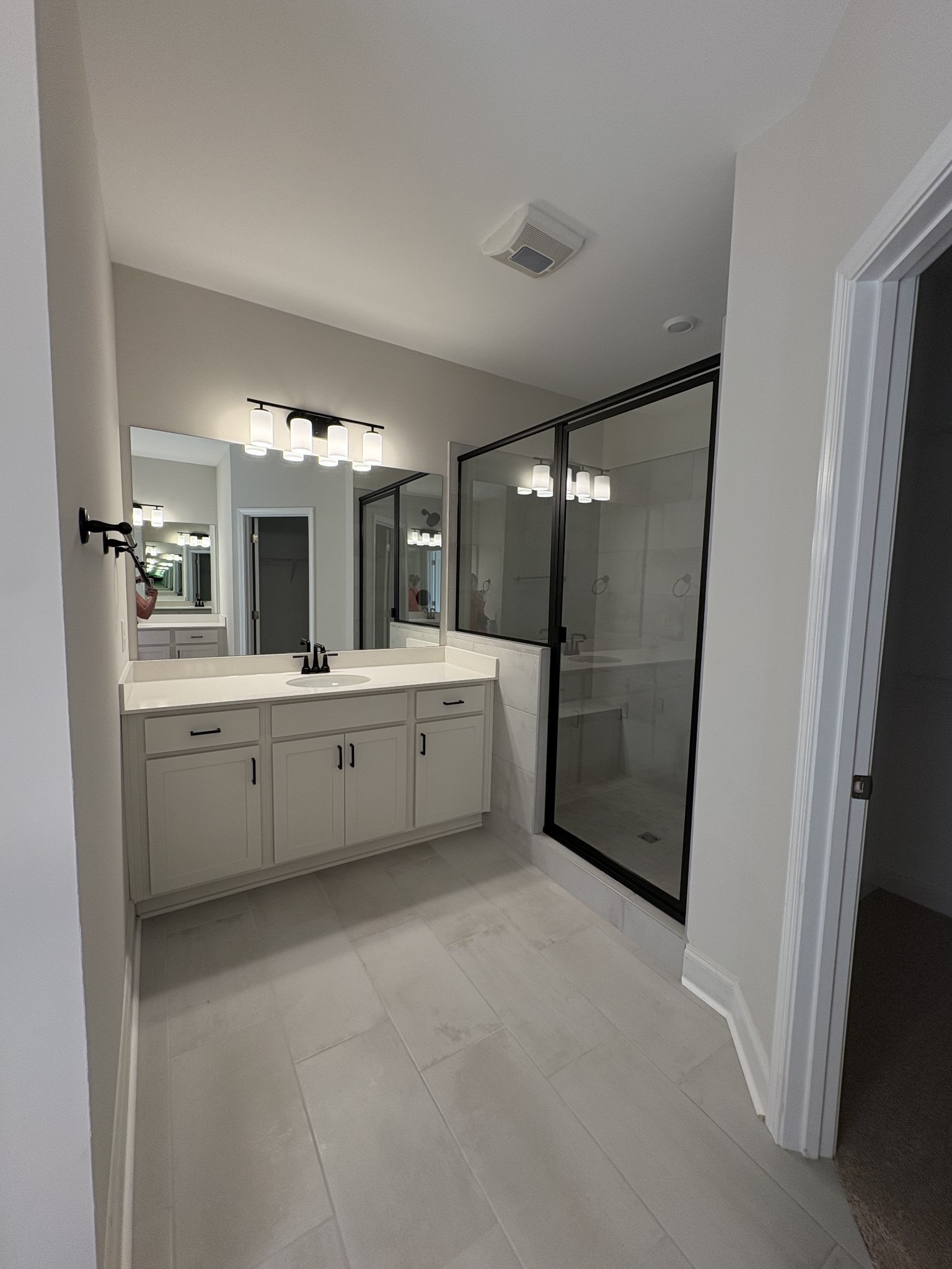 7355 Carothers Road La Vergne, TN 37086 - Photo 17 of 44 a bathroom with a double vanity sink mirror and shower