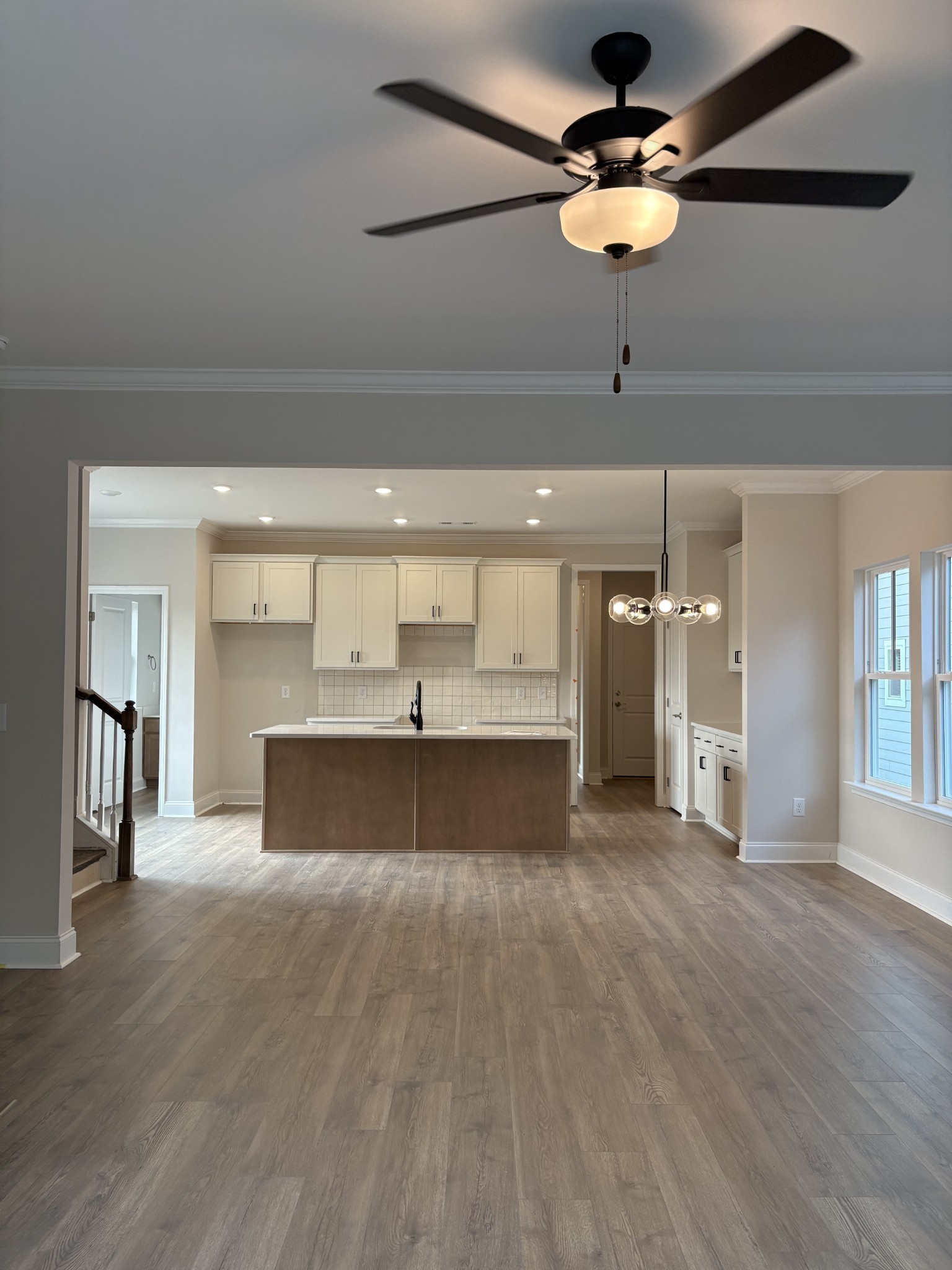 7355 Carothers Road La Vergne, TN 37086 - Photo 6 of 44 a view of a room with a chandelier and wooden floor