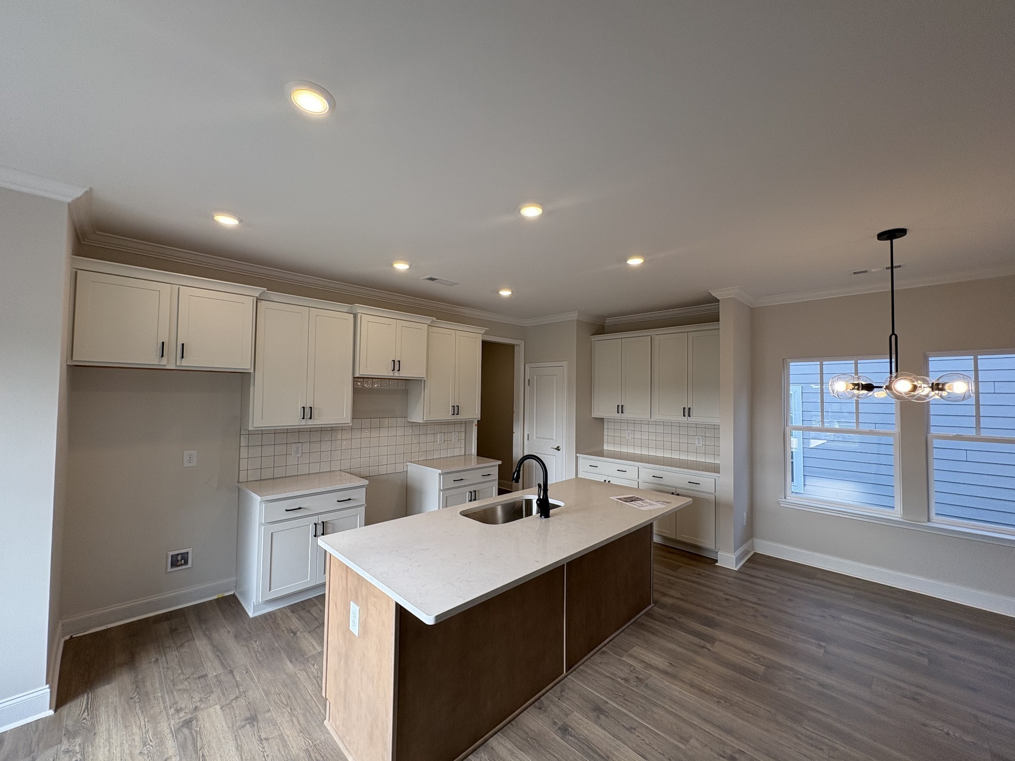 7355 Carothers Road La Vergne, TN 37086 - Photo 9 of 44 a kitchen with kitchen island a sink stainless steel appliances and cabinets