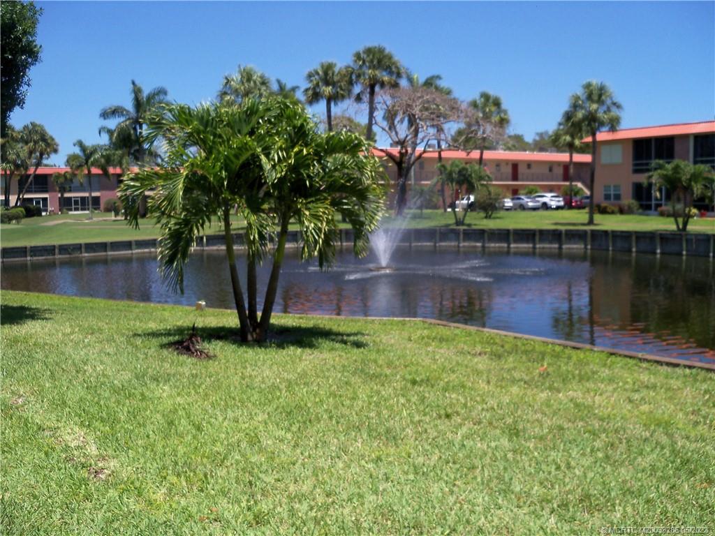 1901 Southwest Palm City Road, Unit A 1 Stuart, FL 34994 - Photo 29 of 42 View of lake and fountain