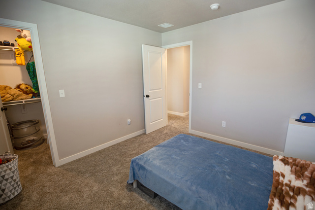 983 South 950 West Provo, UT 84601 - Photo 43 of 56 Carpeted room with light neutral wall paint