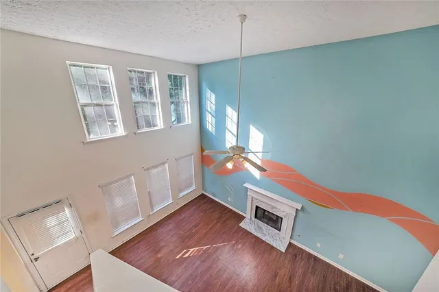 a room with furniture and a wooden floor