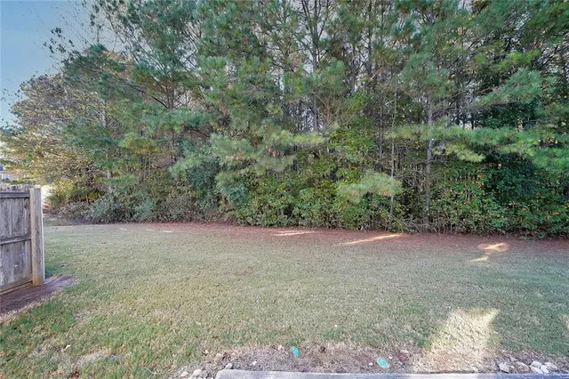 a view of a yard with a tree