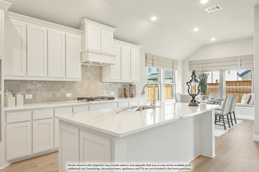 1141 Hitching Post Way Oak Point, TX 75068 - Photo 11 of 39 a kitchen with stainless steel appliances granite countertop a lot of counter space and wooden floors
