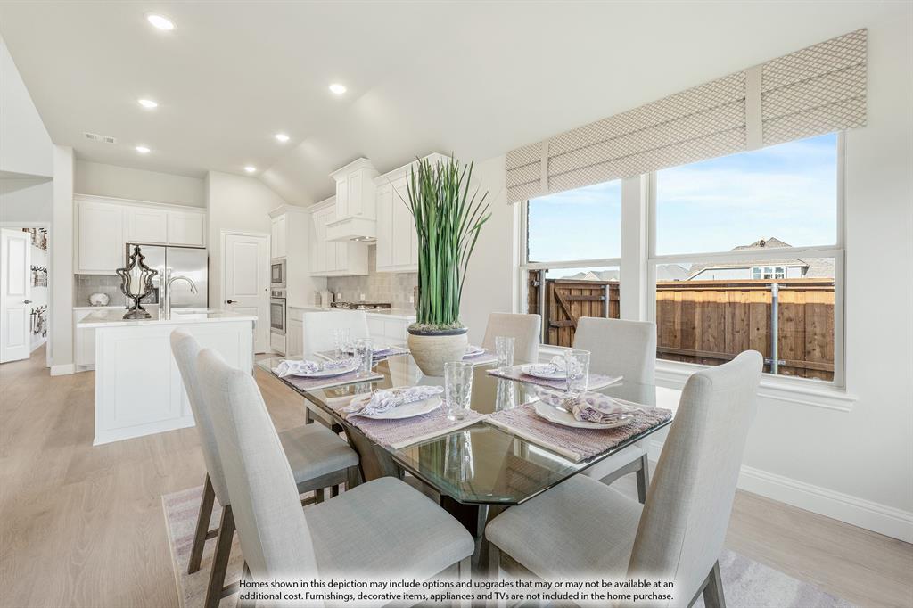1141 Hitching Post Way Oak Point, TX 75068 - Photo 17 of 39 a view of a dining room with furniture window and outside view
