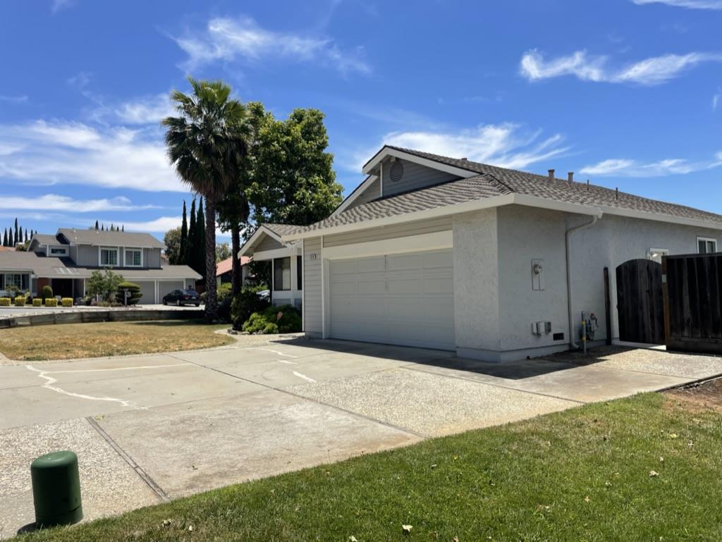 3550 Slopeview Drive San Jose, CA 95148 - Photo 3 of 7 a front view of a house with a yard and garage