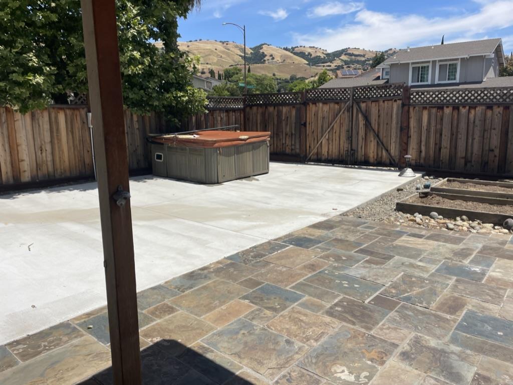 3550 Slopeview Drive San Jose, CA 95148 - Photo 7 of 7 a backyard of a house with a bench