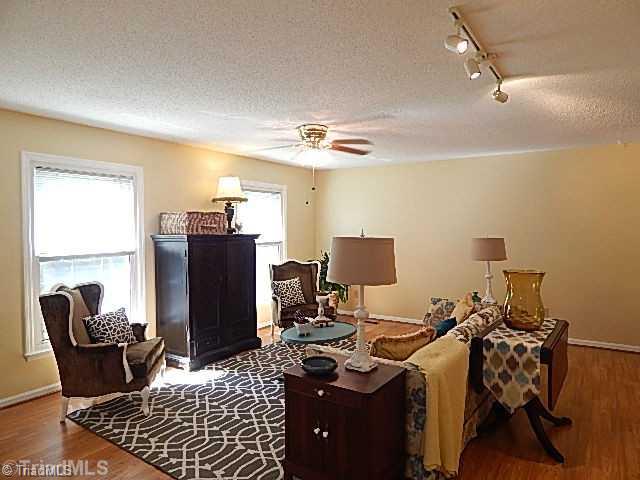 618 Pepperidge Road Lewisville, NC 27023 - Photo 2 of 16 Living Room. Spacious living room with laminate flooring.