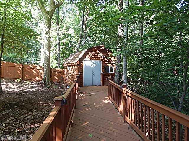 618 Pepperidge Road Lewisville, NC 27023 - Photo 15 of 16 Patio/Deck. Decking leading to workshop.