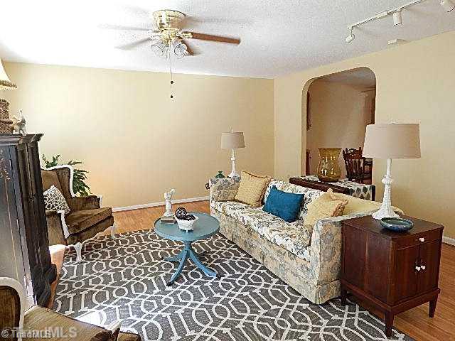 618 Pepperidge Road Lewisville, NC 27023 - Photo 3 of 16 Living Room. Arched opening from living room to dining.