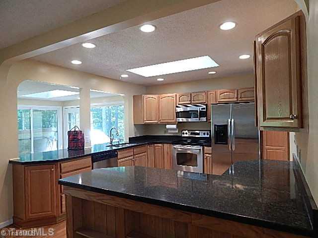 618 Pepperidge Road Lewisville, NC 27023 - Photo 5 of 16 Kitchen. Lots of light in kitchen from skylight and recessed lighting.