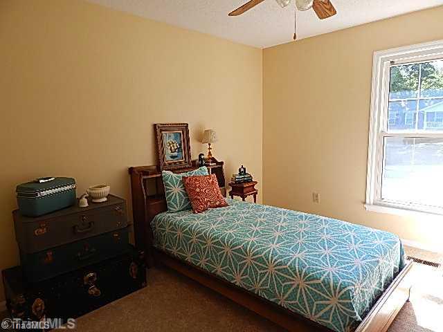 618 Pepperidge Road Lewisville, NC 27023 - Photo 8 of 16 2nd Bedroom. Ceiling fan in guest bedroom and new carpet.