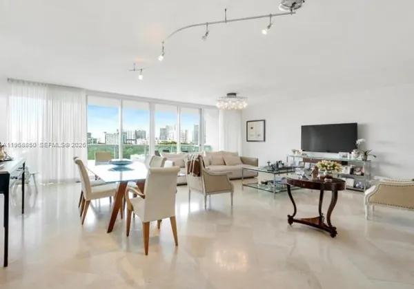 a living room with lots of furniture and a flat screen tv