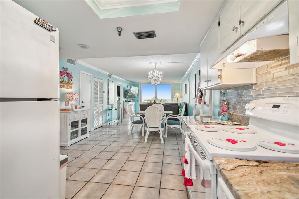 5915 Sea Ranch Drive, Unit 308 Hudson, FL 34667 - Photo 16 of 64 a room with furniture a flat screen tv and a table