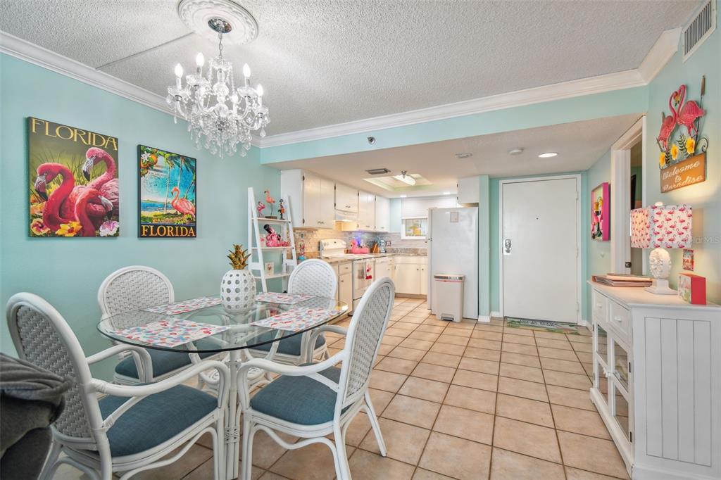 5915 Sea Ranch Drive, Unit 308 Hudson, FL 34667 - Photo 21 of 64 a view of a dining room with furniture and chandelier