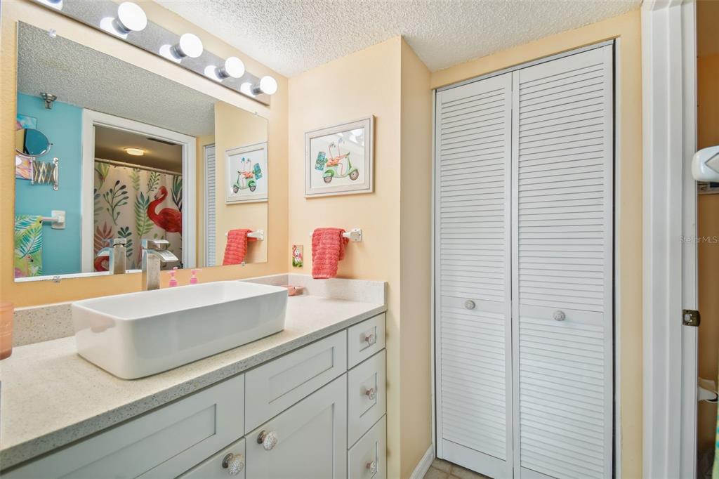 5915 Sea Ranch Drive, Unit 308 Hudson, FL 34667 - Photo 34 of 64 a bathroom with a sink and a mirror
