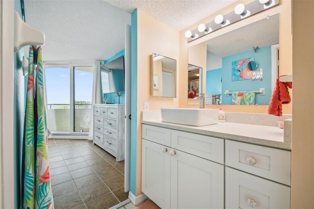 5915 Sea Ranch Drive, Unit 308 Hudson, FL 34667 - Photo 36 of 64 a bathroom with a sink vanity and mirror
