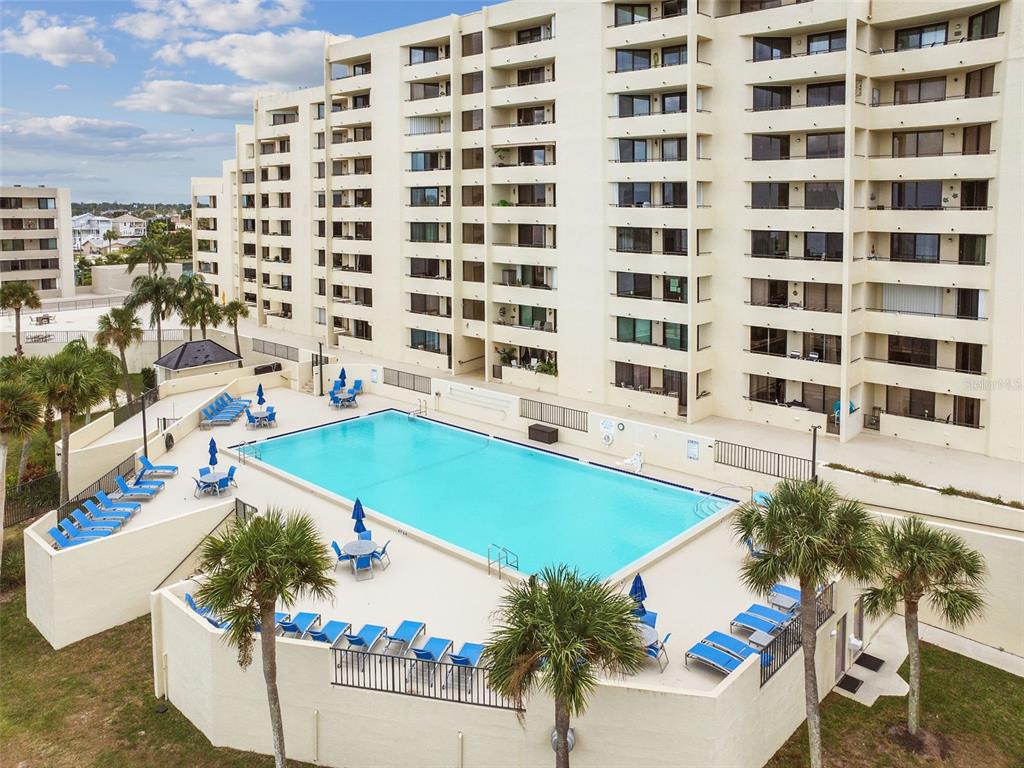 5915 Sea Ranch Drive, Unit 308 Hudson, FL 34667 - Photo 38 of 64 a view of a swimming pool with outdoor seating