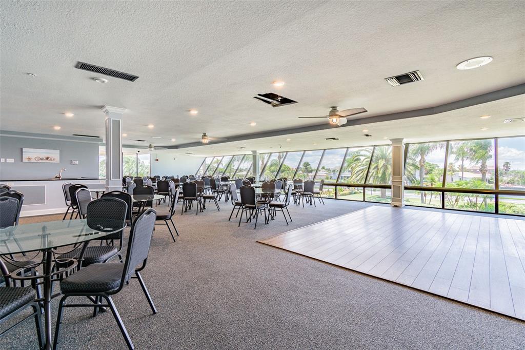5915 Sea Ranch Drive, Unit 308 Hudson, FL 34667 - Photo 53 of 64 a very nice looking dining room with furniture water view and a large window