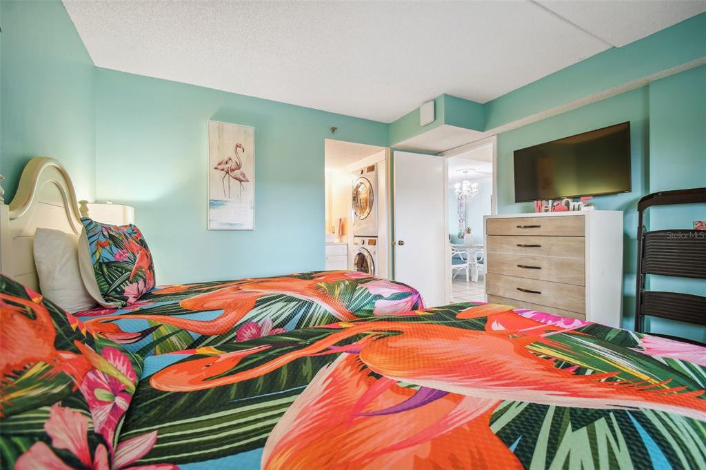 5915 Sea Ranch Drive, Unit 308 Hudson, FL 34667 - Photo 6 of 64 a bedroom with a bed and a flat screen tv