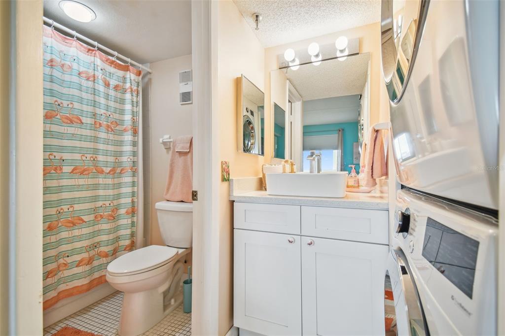 5915 Sea Ranch Drive, Unit 308 Hudson, FL 34667 - Photo 7 of 64 a bathroom with a sink a toilet a shower and a mirror
