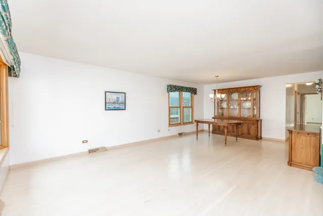 a view of workspace with furniture and window