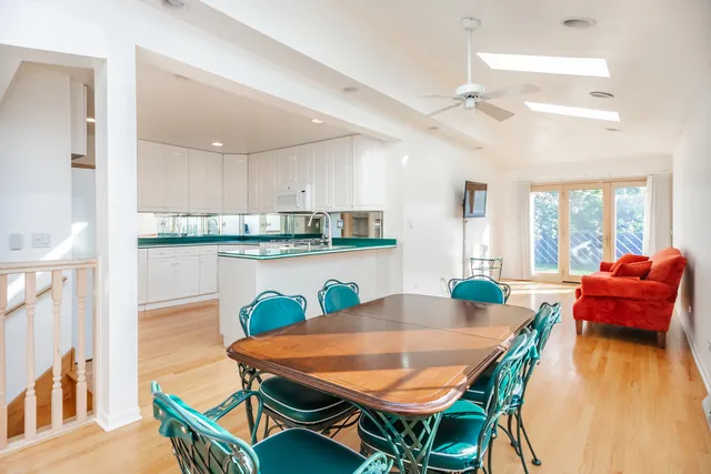 a view of a dining room with furniture and a table