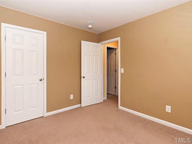 7112 Racine Way Raleigh, NC 27615 - Photo 20 of 25 an empty room with closet area