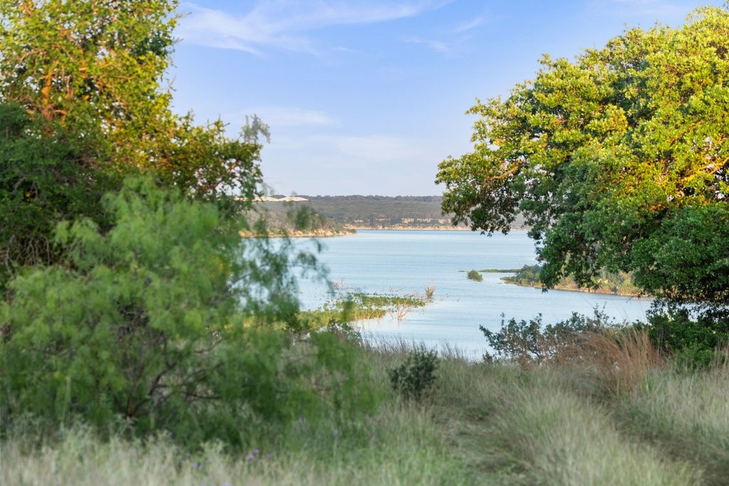 2101 Tower Road Georgetown, TX 78628 - Photo 17 of 38 a view of a lake with a mountain in the back